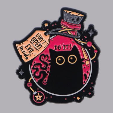 The Black Cat Enamel Pin by KittyNook Cat Co. features a pink potion bottle labeled